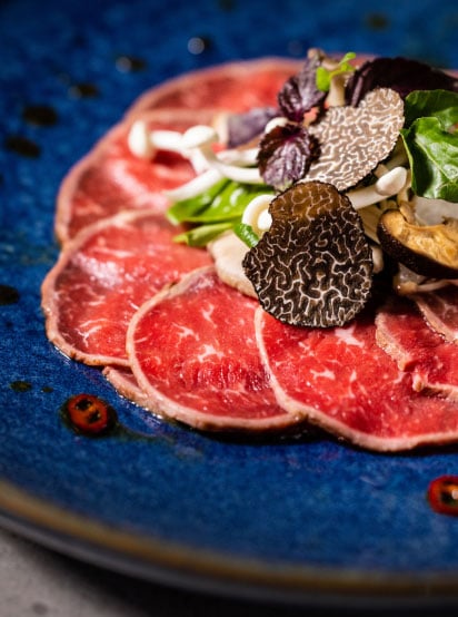 Beef carpaccio with mushroom, pear and watercress